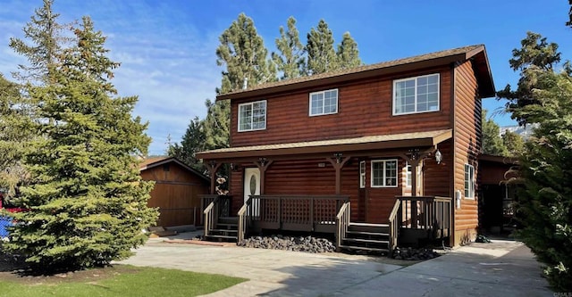 log home with a storage shed