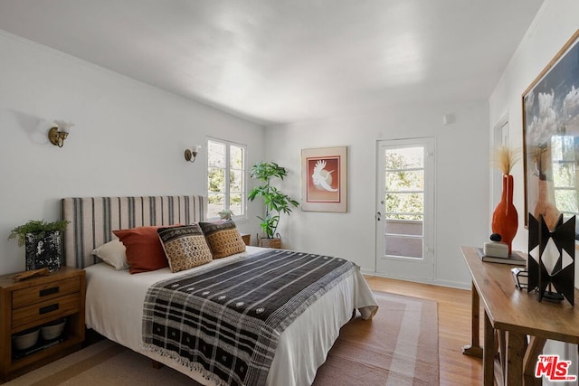 bedroom with light hardwood / wood-style floors