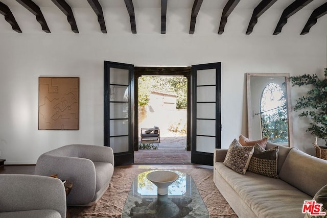 living room featuring french doors and beamed ceiling