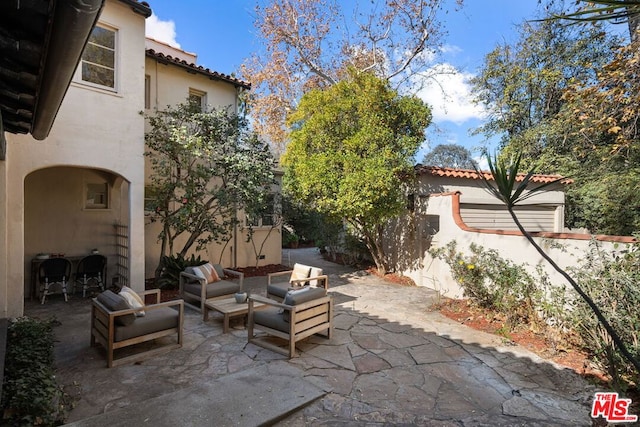 view of patio with an outdoor living space and area for grilling