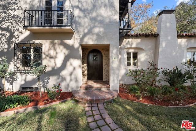 doorway to property with a balcony