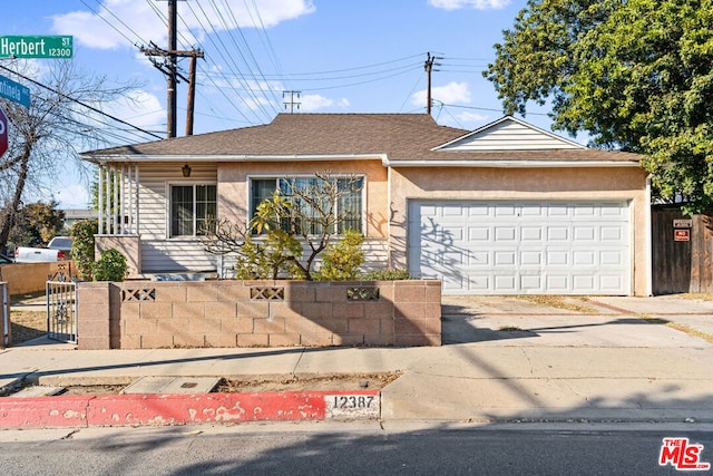 single story home with a garage