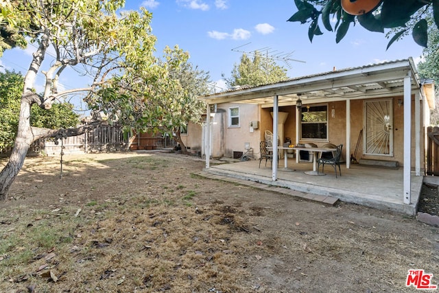 rear view of house featuring a patio