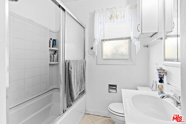 full bathroom with tile patterned floors, toilet, shower / bath combination, and sink