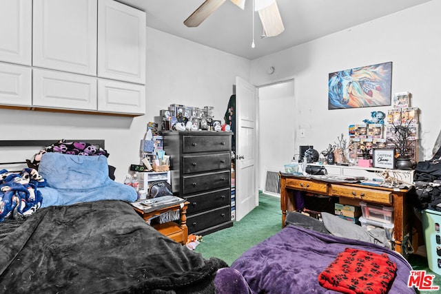 bedroom with dark colored carpet, ceiling fan, and a closet