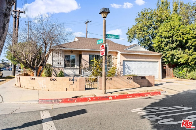 ranch-style house featuring a garage