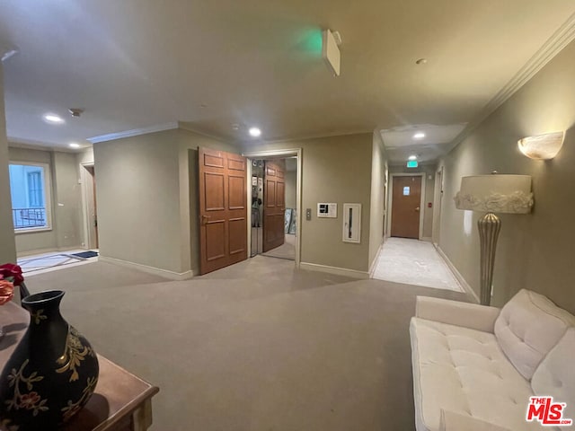 corridor with light colored carpet and ornamental molding