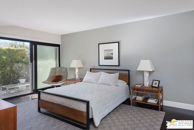 bedroom featuring access to outside and dark hardwood / wood-style floors