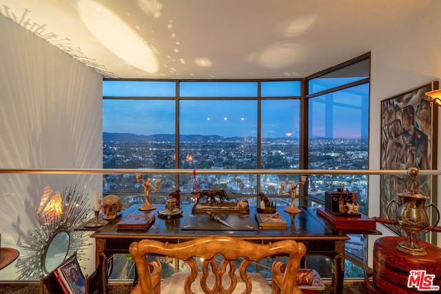 interior space featuring a mountain view and expansive windows