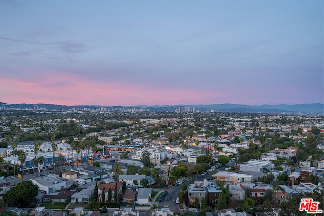 aerial view at dusk with a mountain view