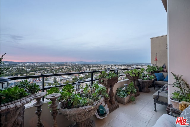 view of balcony at dusk