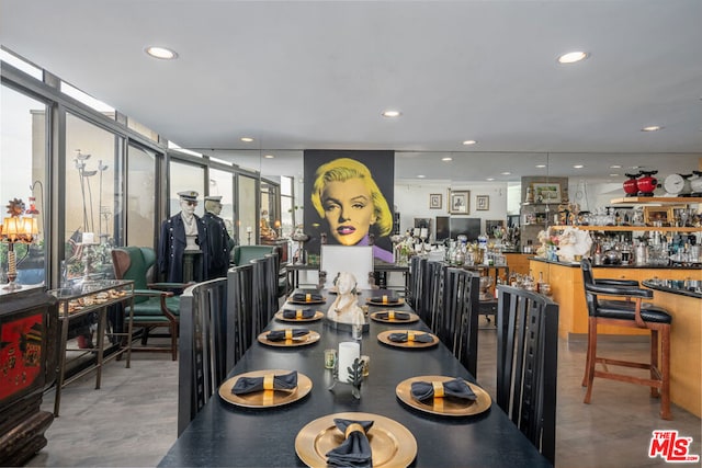 dining area featuring floor to ceiling windows and a wealth of natural light