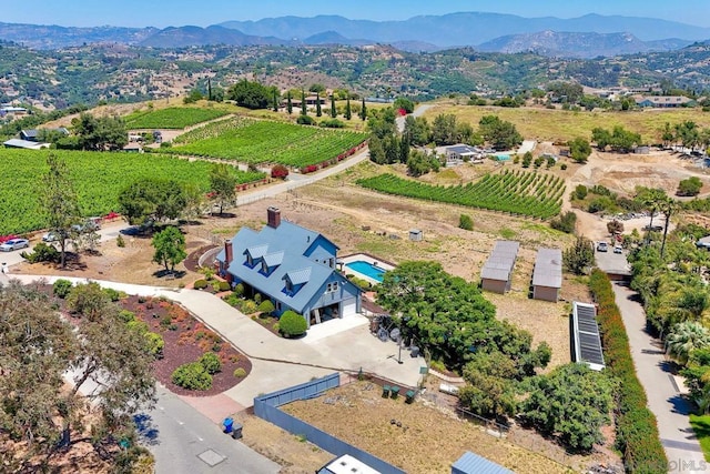 drone / aerial view featuring a rural view and a mountain view