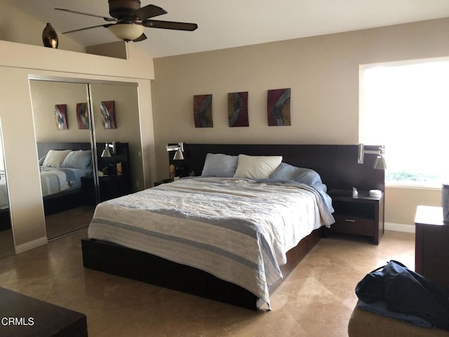 bedroom featuring a closet, ceiling fan, and lofted ceiling