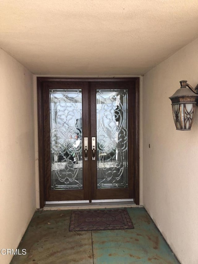 entrance to property featuring french doors