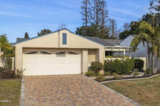 view of front of house with a garage and a front lawn