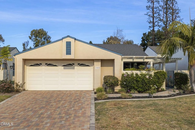 ranch-style home with a garage, a front yard, and a pergola