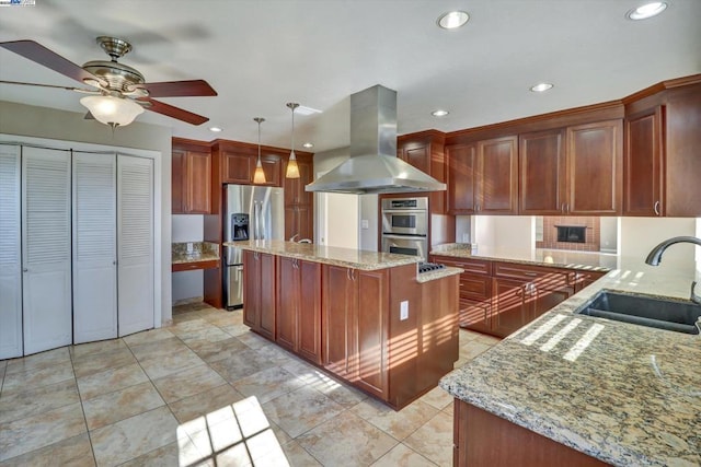 kitchen featuring hanging light fixtures, appliances with stainless steel finishes, sink, a center island, and island range hood