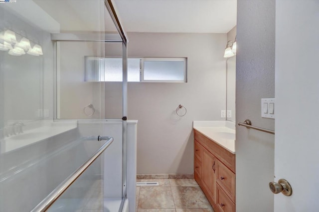 bathroom with tile patterned floors, vanity, and shower with separate bathtub