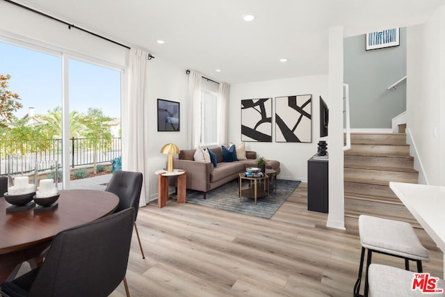 living room with light hardwood / wood-style flooring