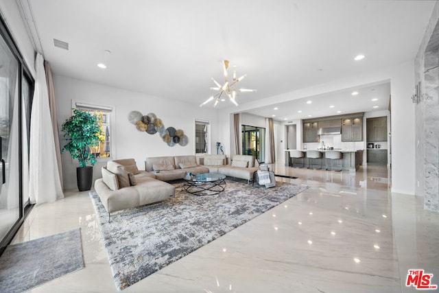 living room featuring a notable chandelier