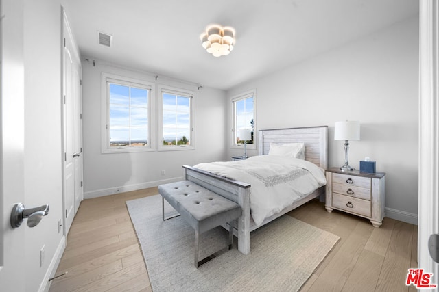 bedroom featuring light hardwood / wood-style floors