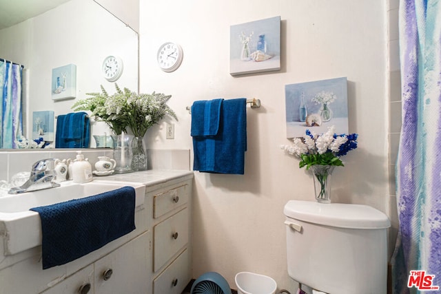 bathroom featuring sink and toilet