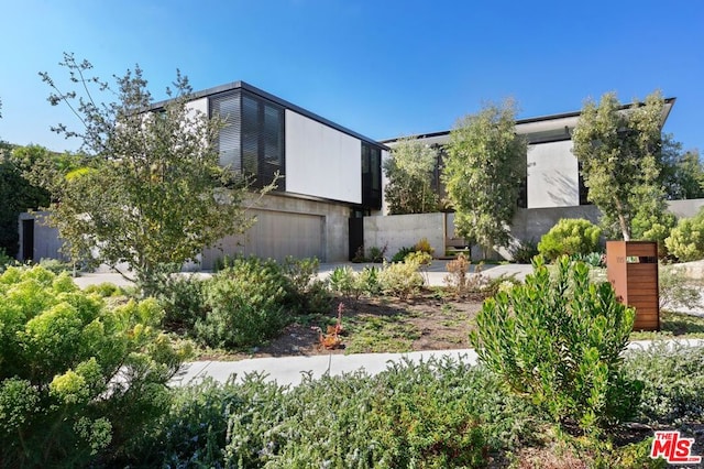 view of side of home featuring a garage