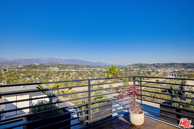 balcony featuring a mountain view