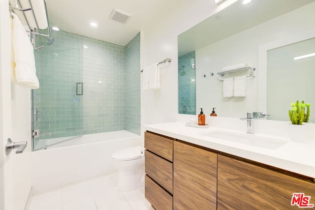 full bathroom featuring tile patterned flooring, vanity,  shower combination, and toilet