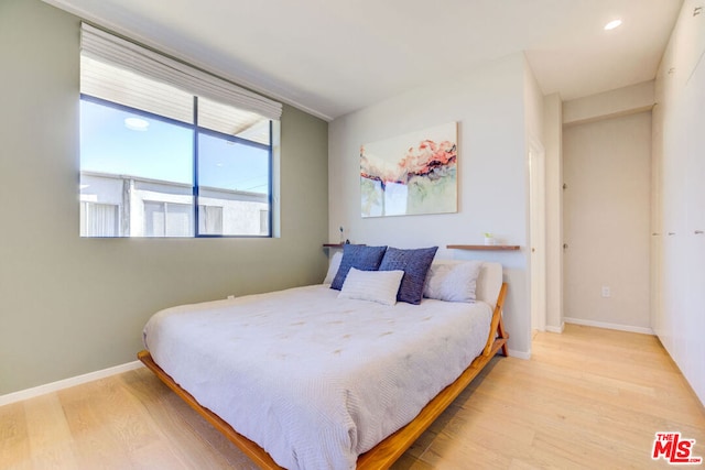 bedroom featuring light hardwood / wood-style flooring