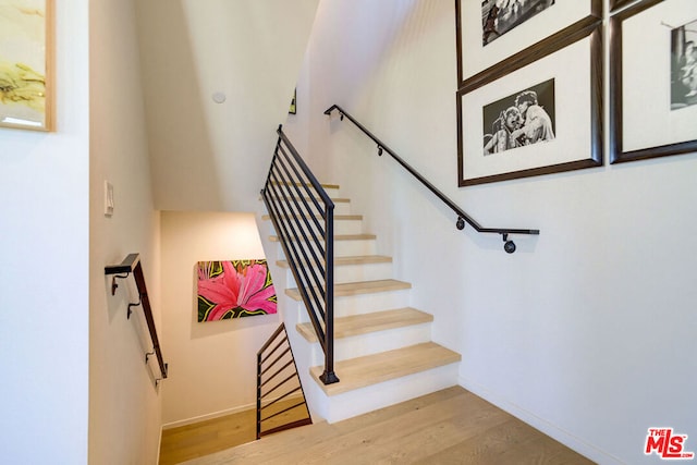 stairway with wood-type flooring