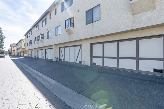 view of property with community garages