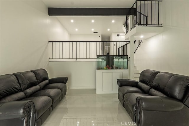 living area with recessed lighting, visible vents, beamed ceiling, and stairs