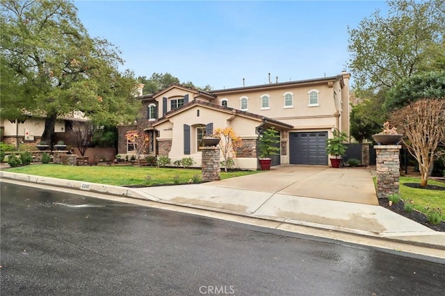 view of front of property featuring a garage and a front yard