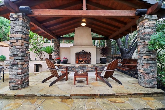 view of patio / terrace with a gazebo and a fireplace