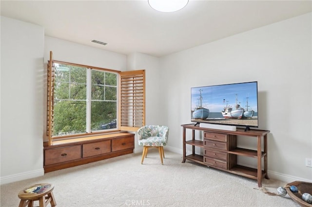 sitting room featuring carpet floors