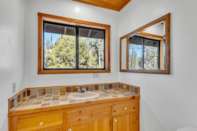 bathroom with vanity and wooden ceiling