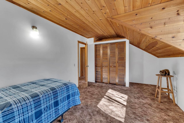 bedroom featuring lofted ceiling, carpet floors, and wooden ceiling