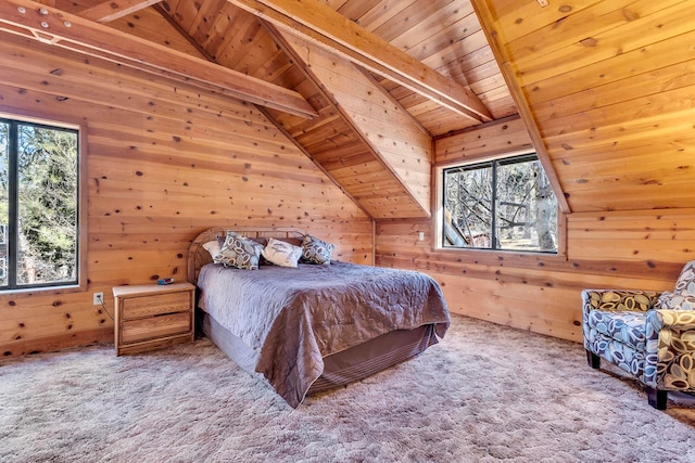 carpeted bedroom featuring multiple windows, wood walls, wooden ceiling, and lofted ceiling with beams