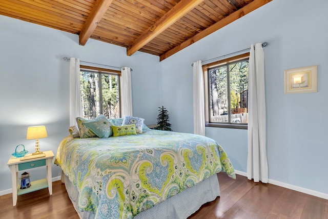 bedroom featuring multiple windows, dark hardwood / wood-style flooring, wood ceiling, and vaulted ceiling with beams