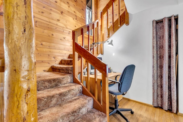 stairway with hardwood / wood-style floors