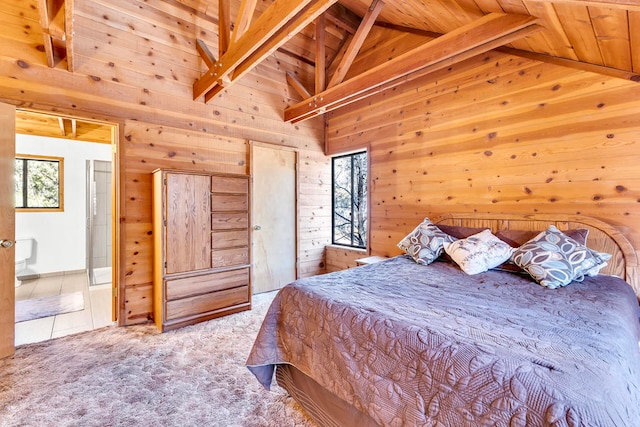 bedroom featuring carpet, multiple windows, wood walls, and wood ceiling