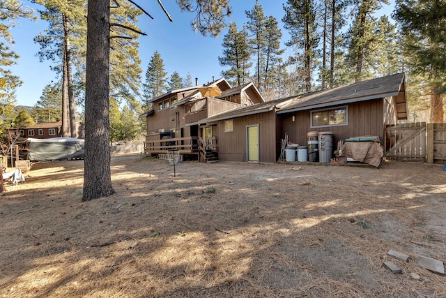 rear view of house featuring a deck