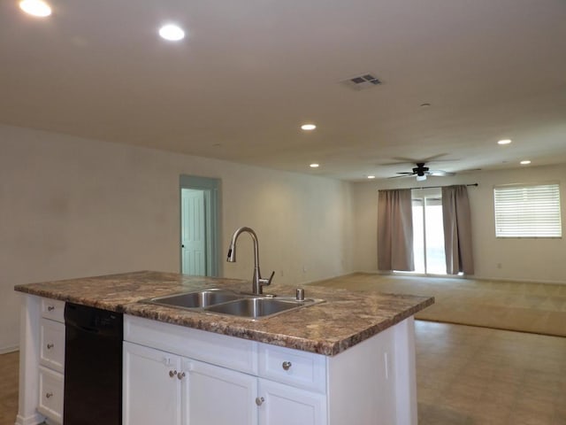 kitchen featuring dishwasher, a kitchen island with sink, sink, ceiling fan, and white cabinetry