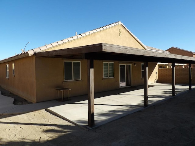 rear view of house with a patio