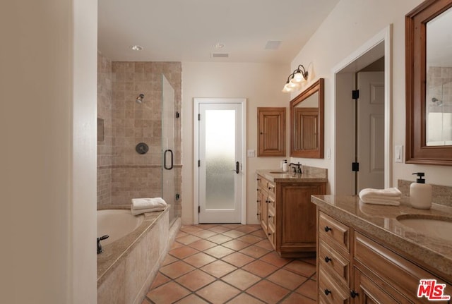 bathroom featuring tile patterned flooring, vanity, and independent shower and bath