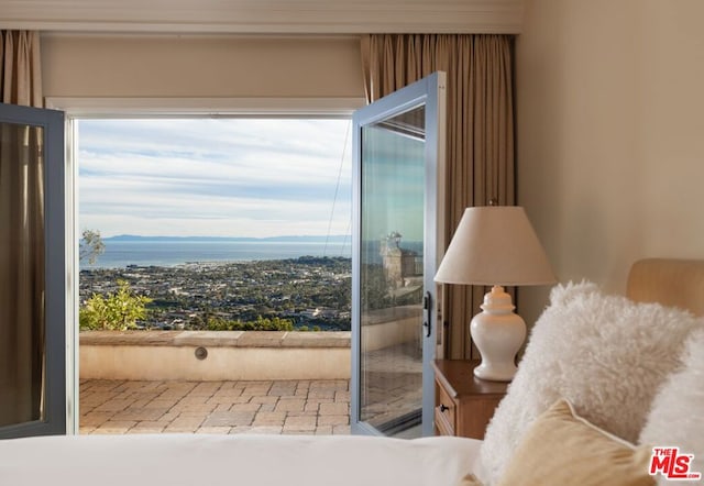 interior space with a water view and multiple windows