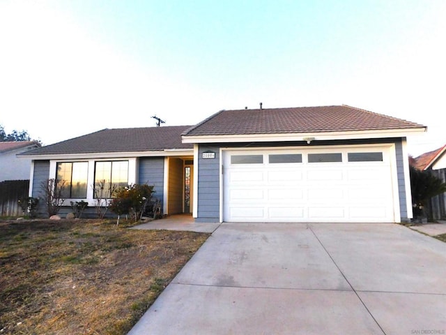 ranch-style home featuring a garage