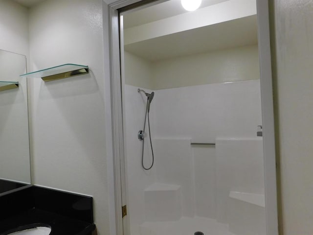 bathroom featuring vanity and walk in shower